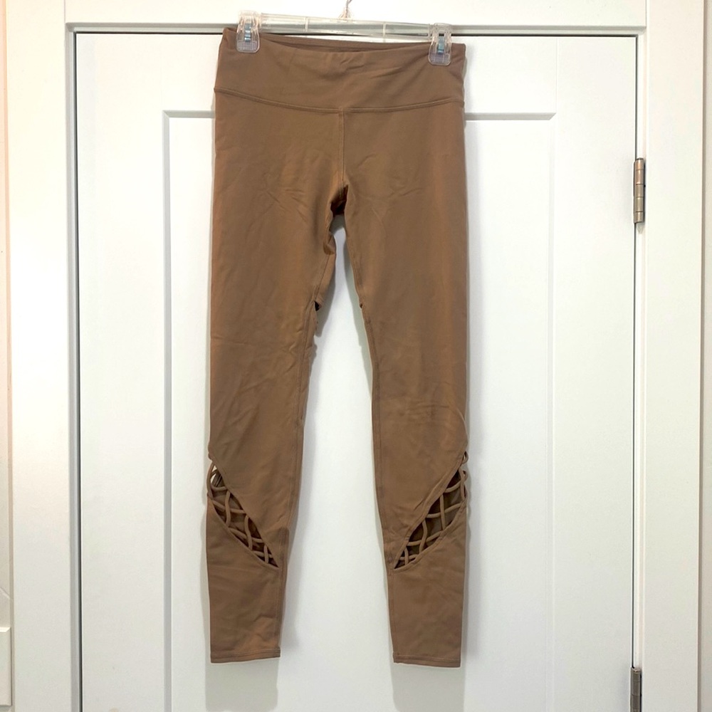 Alo leggings tan with cross cross cutouts. Size small